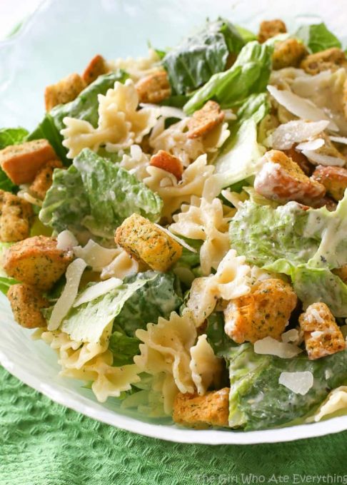 Bowtie Chicken Caesar Salad - a great way to bulk up a salad is to add cooked pasta to it! Try it and you'll never go back. the-girl-who-ate-everything.com