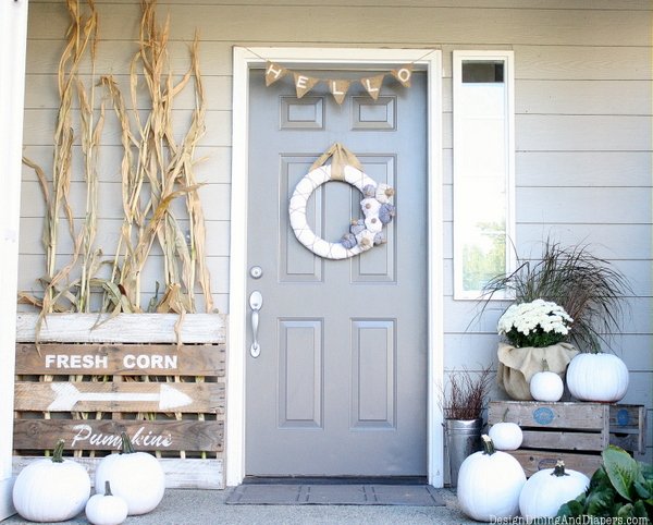 Neutral Fall Porch by Design, Dining + Diapers, neutral fall decor, white pumpkins, corn stalks, Vintage Farm house signs, gray door, fabric wreath, burlap bunting