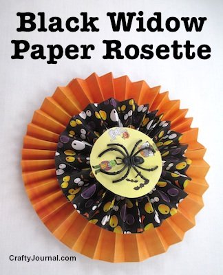 Create a black widow paper rosette with orange and black strips of Halloween paper. By Crafty Journal.