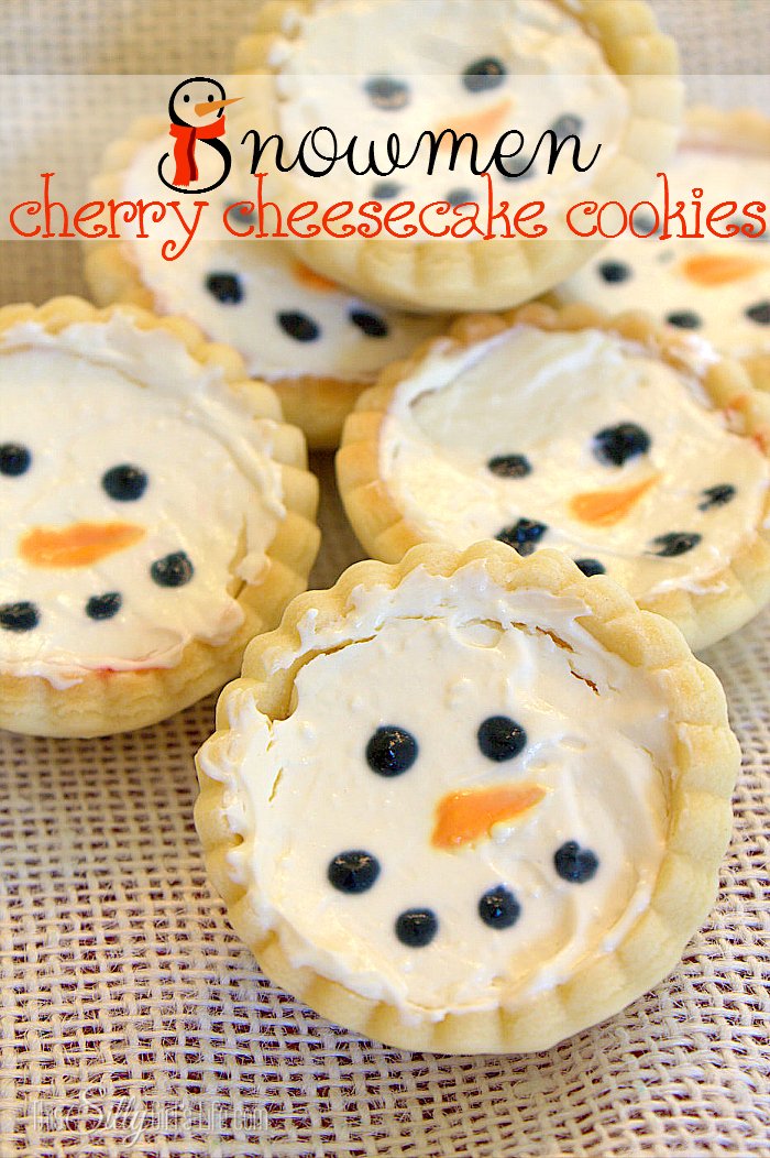 Snowmen Cherry Cheesecake Cookies, cute cookie cups filled with cherry pie filling and no bake cheesecake. Decorated as little snowmen! - ThisSillyGirlsLife.com #TasteTheSeason #ad