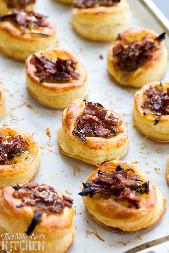 Caramelized Onion Bacon Tarts, sweet onions, salty bacon, herbs and Parmesan cheese atop puffed pastry make this an easy and elegant appetizer! from ThisSillyGirlsLife.com #caramelizedonion #bacon