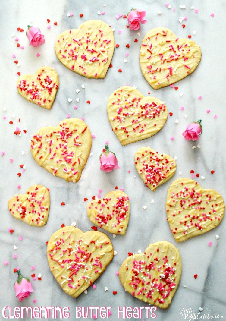 Tender and kissed with just the right touch of clementine sweetness, Clementine Butter Hearts pair with coffee, tea or chocolate. You can also use a cookie press! Recipe at littlemisscelebration.com