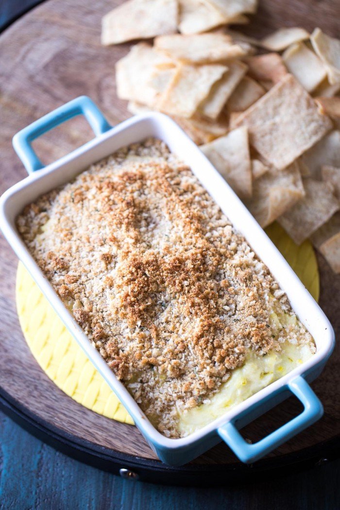 Dill pickle dip with cream cheese, Parmesan cheese and lots of dill pickles! The crunchy topping makes this easy dip taste just like a fried pickle! lemonsforlulu.com