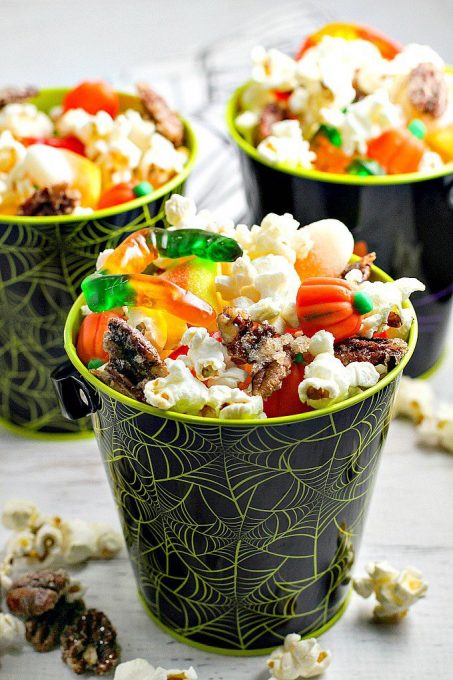  Monster Munch Popcorn Snack Mix is a fun Halloween snack for both kids and adults. Plus, the popcorn mix is easily customizable for any holiday theme!