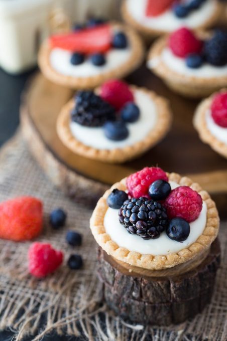 Cream Cheese Fruit Tarts - A sweet and vibrant way to dress up your party's dessert table! These decadent treats won't last long.